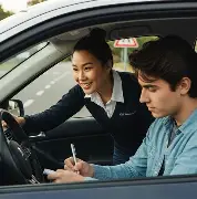 Driving instructor teaching student